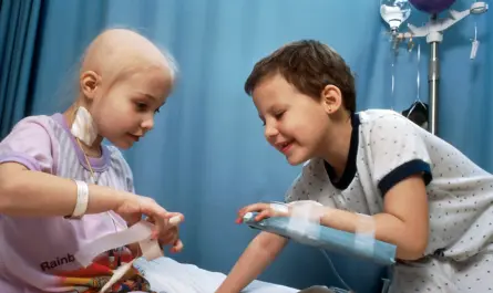 girl and boy playing on bed